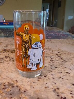 Coca Cola Star Wars Glass with Orange, White, Yellow and Blue Artwork